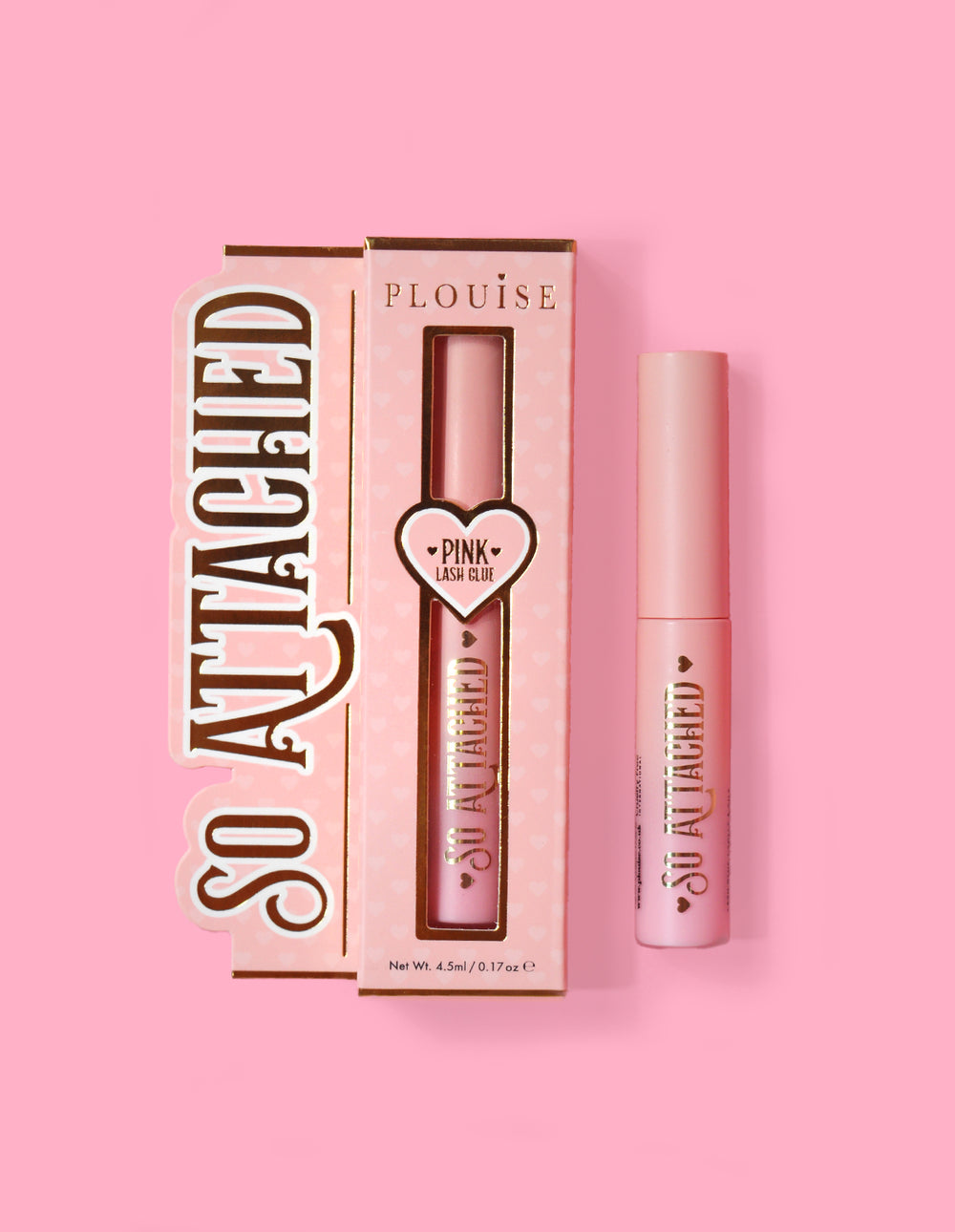 P.Louise So Attached Lash Glue product packaging and the glue tube itself, placed against a pink background.