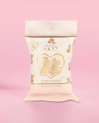 Pack of heart-shaped cotton pads with teddy bear design on a pink background