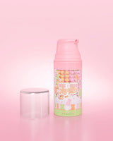 Purple bottle of P. Louise Here I Glow Again Candy Bears Recovery Mask on a pink background